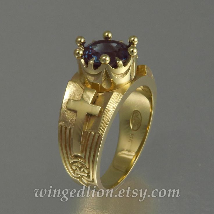 "Inspired by Medieval art, THE BOOK ring will be made in 14k yellow gold with a 9mm lab-created round alexandrite, prong set in the crown. Natural Alexandrite is a very rare and expensive gemstone that displays a color change from blue-green in daylight to purplish-red under incandescent light. The true synthetic Alexandrite is not an imitation, but a crystal grown by the vertically pulled method, also known as Czochralski pulled. So, the material is completely the same as the best varieties of Book Ring, Book Rings, Incandescent Light, Pink Topaz, Medieval Art, Blue Band, Green Onyx, Rings Statement, Teal Blue