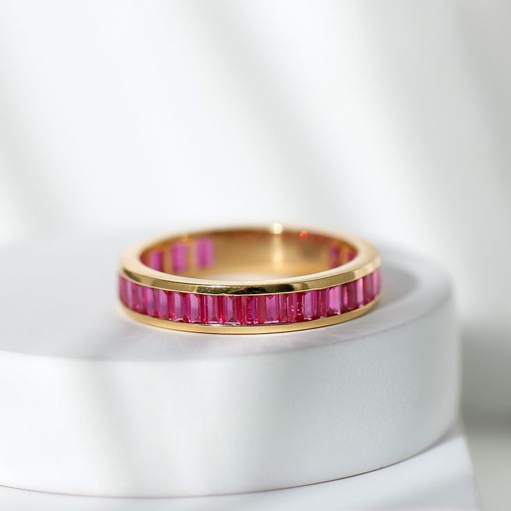 a close up of a ring on a white surface