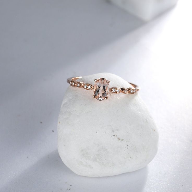 "[ Made to Order ] * Metal: 925 Sterling Silver * Custom Gold Color: Rose Gold plated, Yellow Gold plated, Silver * Main Stone Type: Peach Morganite, Oval, 6*4mm * Side Stone Type: Cubic Zirconia, 10 pcs * Gold KT: 14K Gold * Custom Gold Color: Rose Gold, Yellow Gold, White Gold * Main Stone Type: Peach Morganite, Oval, 6*4mm * Side Stone Type: Natural Diamond, 10 pcs, 0.026 ct. Jewelry Maintenance Tips - avoid chemicals - avoid collision - clean with a soft cloth - avoid water - remove jewelry Oval Topaz Promise Ring With Rose Cut Diamonds, Oval Topaz Ring With Rose Cut Diamonds For Promise, Promise Oval Birthstone Ring With Rose Cut Diamonds, Oval Birthstone Ring With Rose Cut Diamonds For Promise, Oval Crystal Ring With Rose Cut Diamonds For Promise, Delicate Oval Diamond Promise Ring, Dainty Oval Rose Gold Wedding Ring, Dainty Oval Diamond Ring With Accent Stones, Rose Gold Oval Diamond Promise Ring