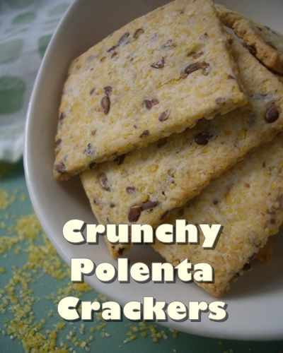 four crackers in a white bowl on a green tablecloth with the words crunchy polenta crackers