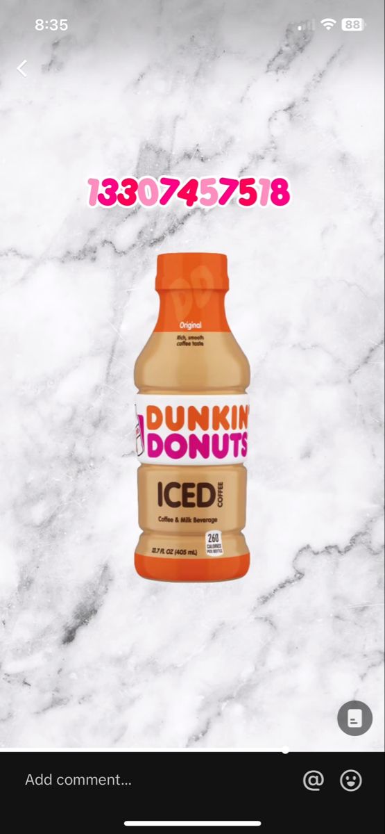 a bottle of dunkin donuts iced on top of a marble counter with the words,