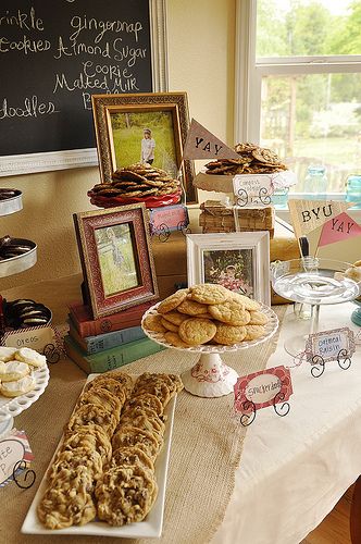 a table filled with lots of different types of cookies and pastries on top of it