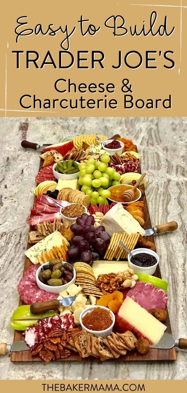 a wooden tray filled with different types of cheeses and crackers on top of a table