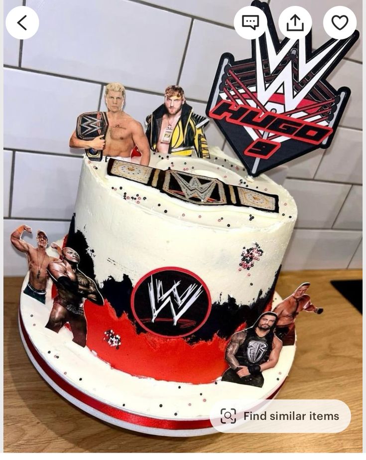 an image of a cake with wrestling figures on it