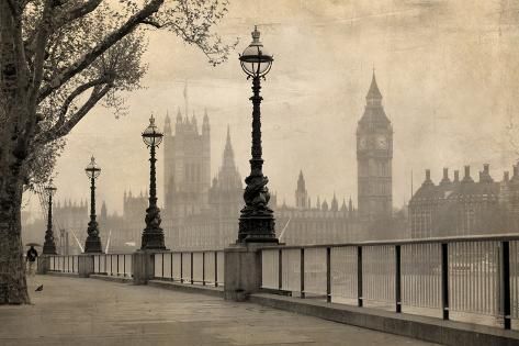 the big ben clock tower towering over the city of london from across the river thames