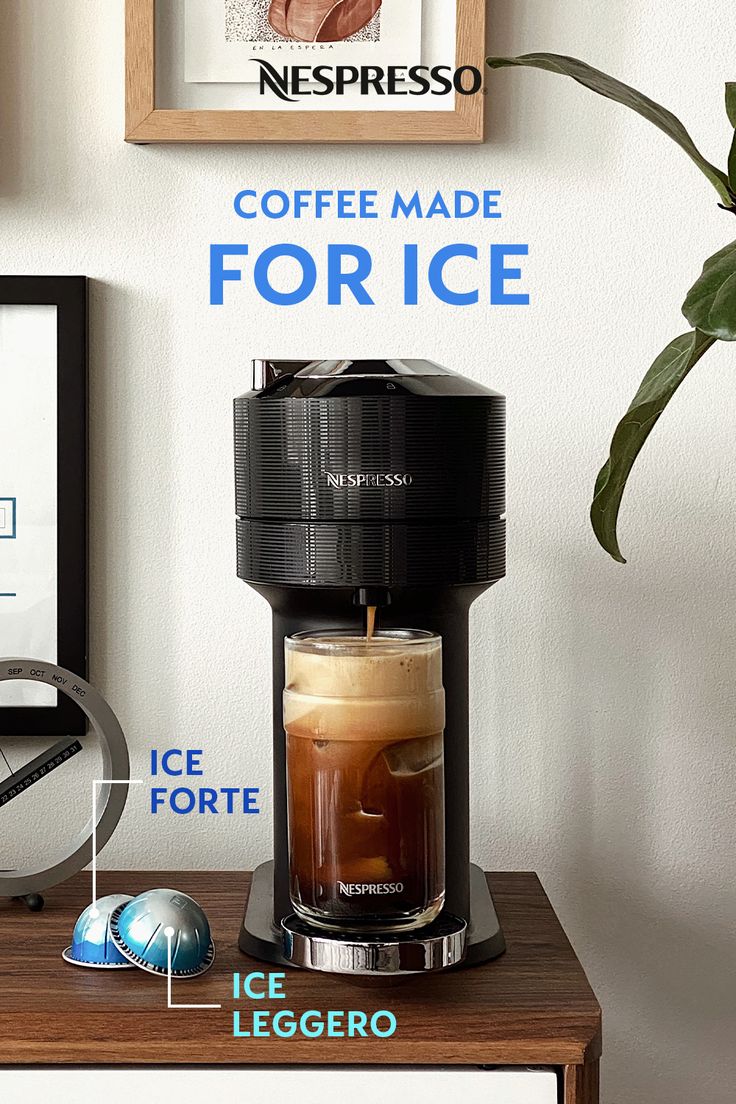 a coffee maker sitting on top of a wooden table