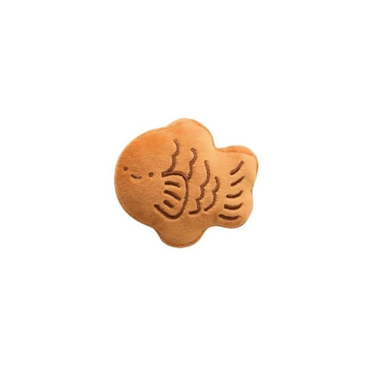 a cookie shaped like a fish on a white background