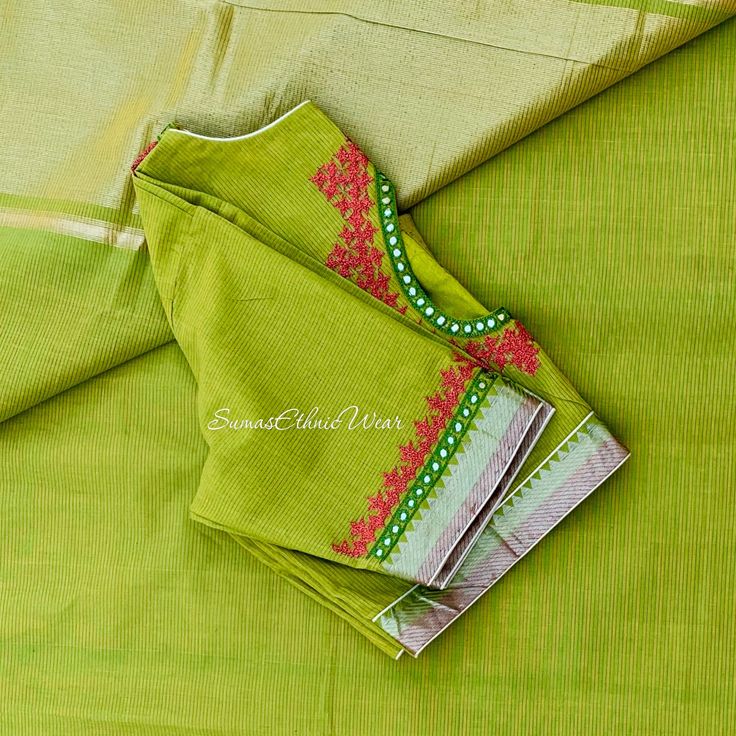 Add a bit of flair to your traditional portfolio with this Light Green Silver Zari Nizam Border Handloom Mangalgiri Cotton Saree. Entire saree is plain with thick Silver zari Pallu. A ready to wear blouse comes with this saree. It has hand embroidery on Keyhole Neckline and Sleeves. Milled from a sumptuous cotton-rich material for superior comfort, this chic creation flaunts shimmer-detailed Kutch designs for a touch of cute charm.  Product : Saree Material : Handloom Mangalagiri Cotton Color : Green Resham Embroidered Cotton Silk Blouse Piece, Festive Pista Green Blouse With Resham Embroidery, Green Blouse Piece With Resham Embroidery For Transitional Seasons, Transitional Green Blouse Piece With Resham Embroidery, Designer Pista Green Blouse With Resham Embroidery, Pista Green Blouse With Zari Work And Traditional Drape, Embroidered Pista Green Chanderi Blouse Piece, Embroidered Pista Green Blouse Piece With Traditional Drape, Pista Green Embroidered Chanderi Blouse Piece