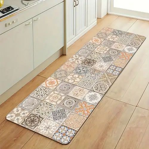 a kitchen area rug with various tiles on the floor in front of an oven and sink