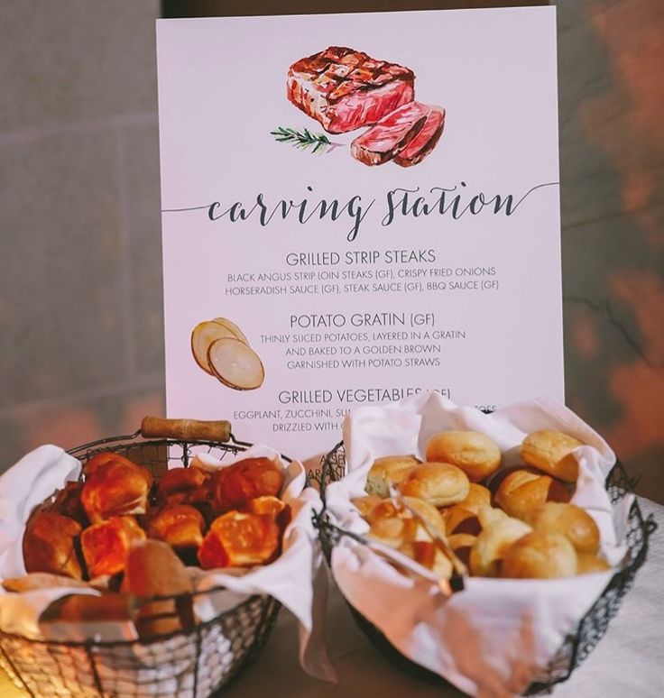 two baskets filled with food next to a menu