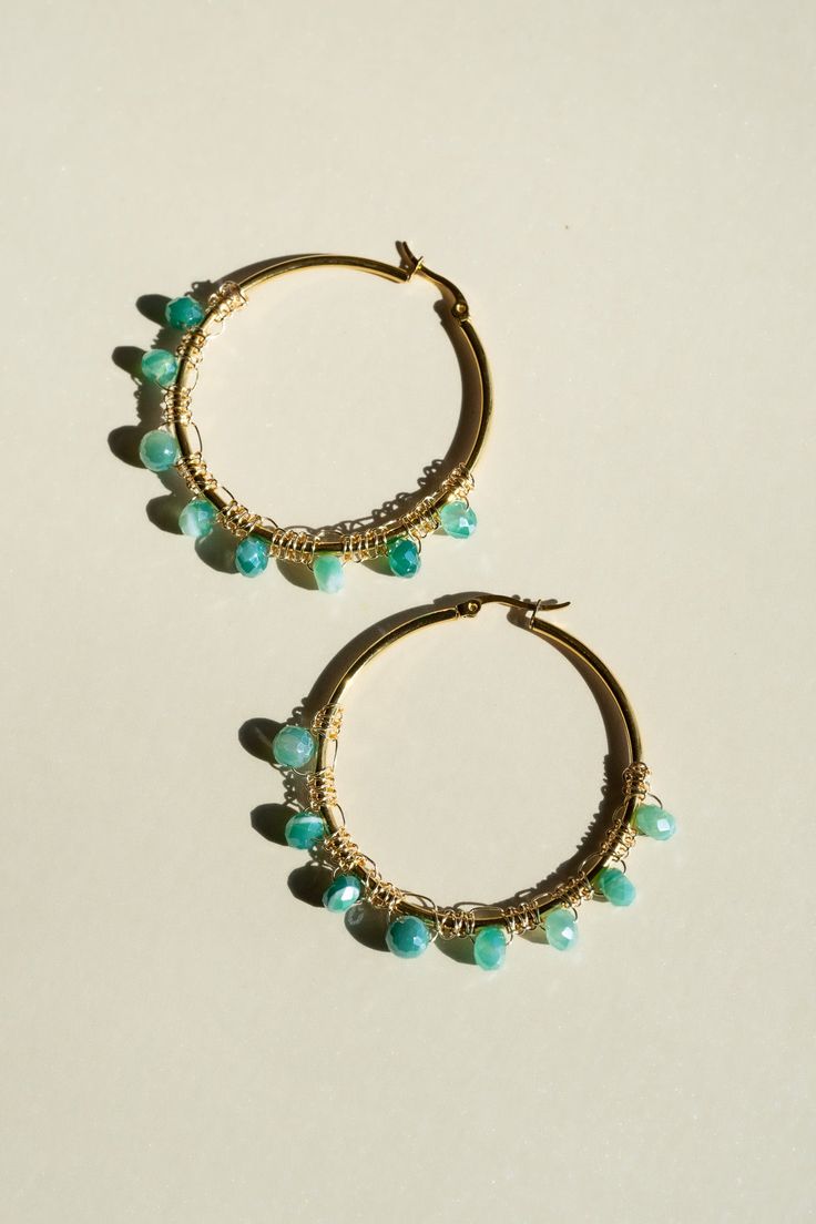 Add a touch of color to your look with these cute mini hoops, handcrafted using the intricate macrame technique. Each pair features beautiful beads that create an understated color statement, making these earrings a must-have addition to any jewelry collection. Lightweight and versatile, they pair perfectly with any outfit, whether you're dressing up for a special occasion or adding a chic touch to your everyday style. These earrings are a staple item, embodying both craftsmanship and contempora Adjustable Hoop Jewelry With Dangling Beads, Everyday Small Hoop Bohemian Earrings, Bohemian Hoop Earrings With Round Beads For Everyday, Bohemian Small Hoop Earrings For Everyday, Everyday Small Hoop Beaded Earrings, Adjustable Small Hoop Jewelry With Dangling Beads, Adjustable Small Hoop Earrings With Dangling Beads, Adjustable Beaded Dangle Hoop Earrings, Everyday Small Hoop Jewelry With Dangling Beads