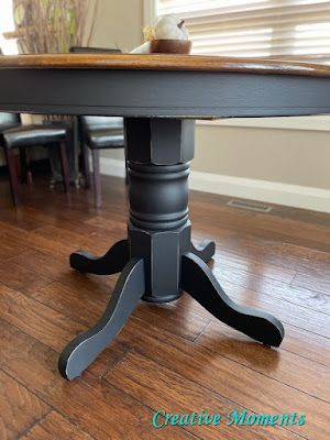 a wooden table sitting on top of a hard wood floor