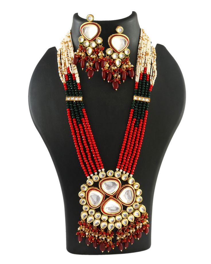 This is a stunning handmade necklace perfect for high end Jewelry Collector, a keeper in Traditional Vintage Indian/Pakistani Bridal jewelry and a Luxury Gift for your Daughter, Sister or Wife on Wedding or Anniversary. Perfect for any type of occasions, weddings And celebrations and a beautiful & memorable gift for weddings and special occasions. -Item Code:- L2376 -Hydro Red Onyx Beaded Necklace Set with Earrings. -Designer multi layered faceted red onyx beaded necklace. -Gold Plated Set with Kundan Stones which shine like Polki Diamonds. -Metal: Gold plated brass -Earrings are 85mm long & 33mm wide approx -Push Back Earrings -Necklace length with pendant 12.5" approx excluding adjustable dori/cord -Quantity:- One Necklace Set Please see more different designs here:- https://www.etsy.com Polki Diamond Necklace, Pakistani Bridal Jewelry, Necklace Set With Earrings, Kundan Necklace Set, High End Jewelry, Kundan Necklace, Pakistani Jewelry, Kundan Necklaces, Earrings Pearl