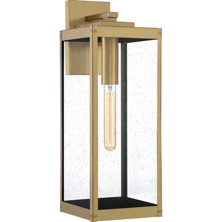 an outdoor wall light with a clear glass cover on the front and side panels,