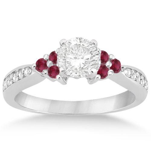 a diamond and ruby engagement ring with two stones on the band, set in 18k white gold