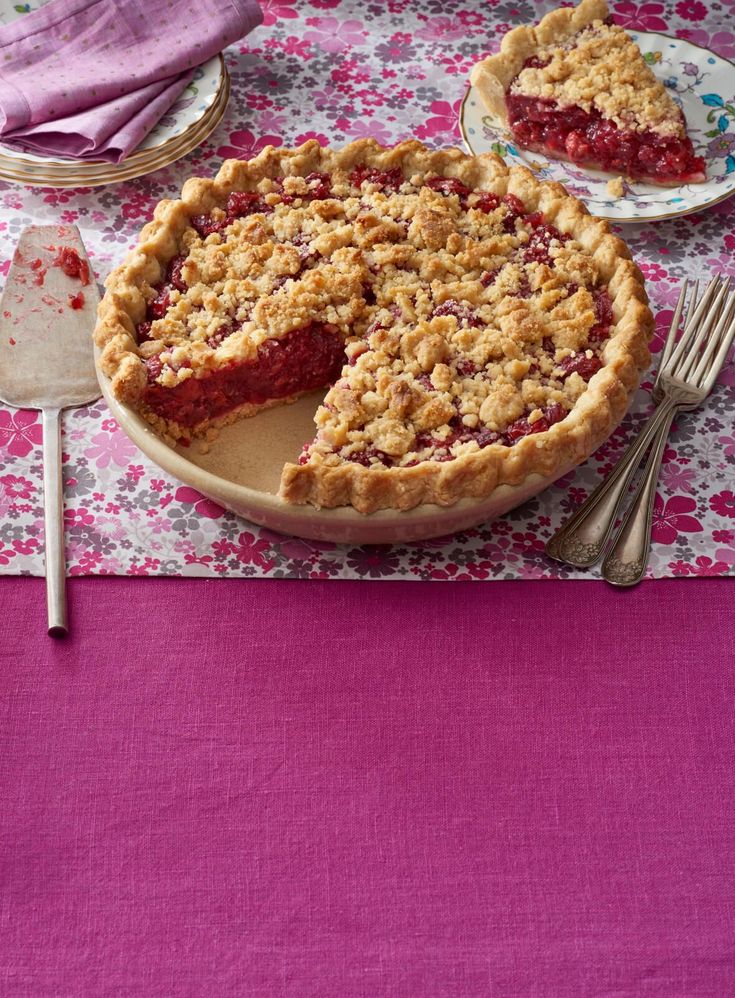 a pie on a table with two slices missing