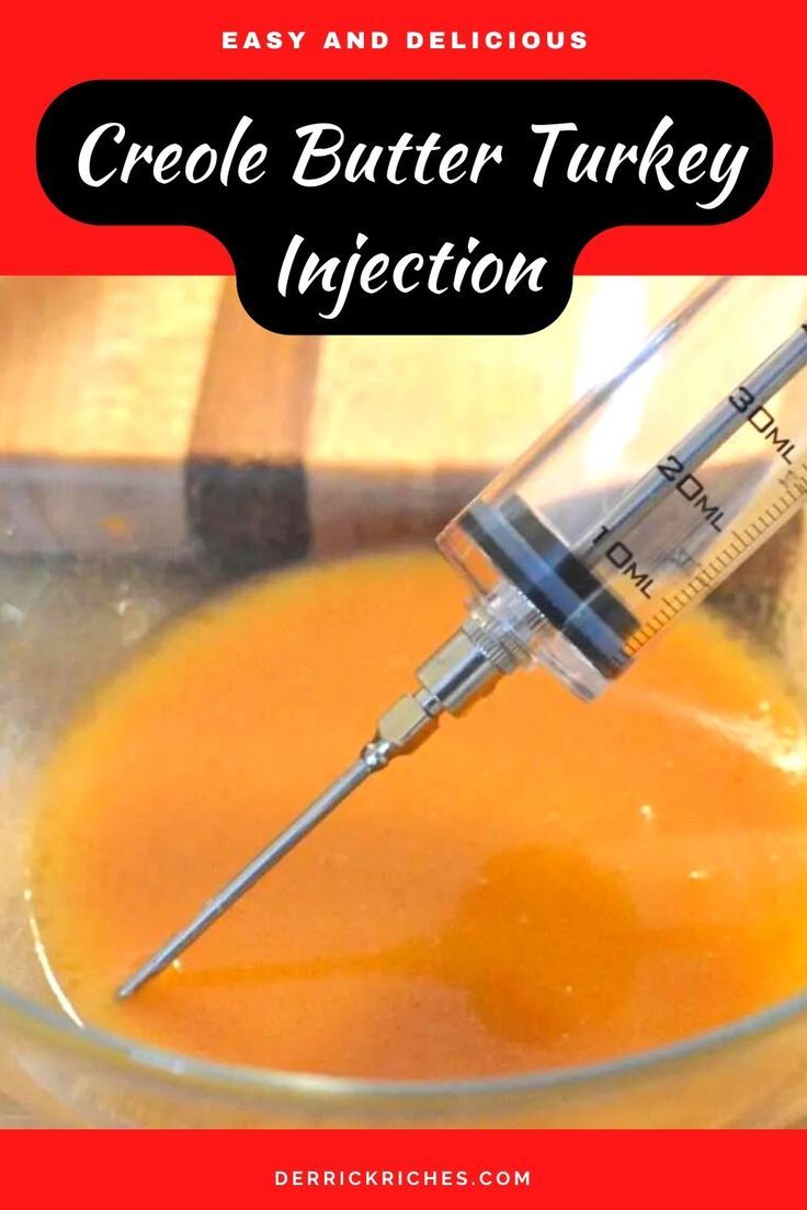 a close up of a glass bowl filled with liquid and a syringe in it