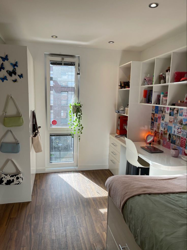 a bedroom with wooden floors and white walls