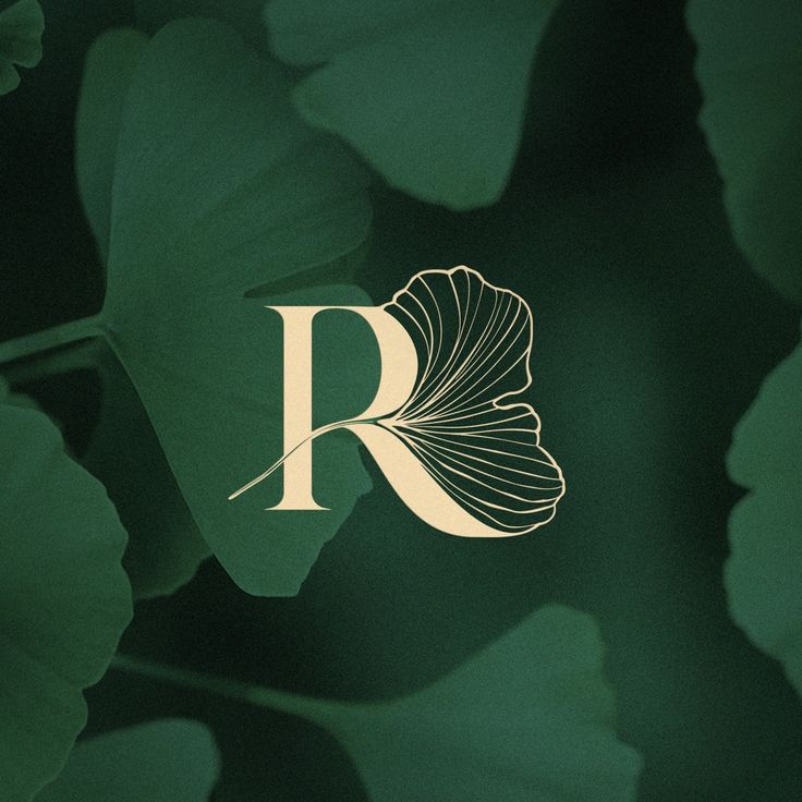 the letter r is surrounded by leaves