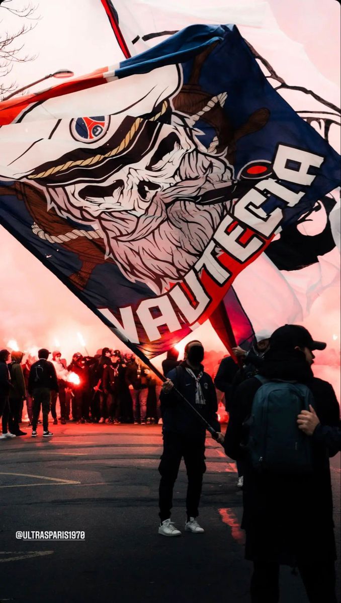 a group of people standing next to each other holding flags