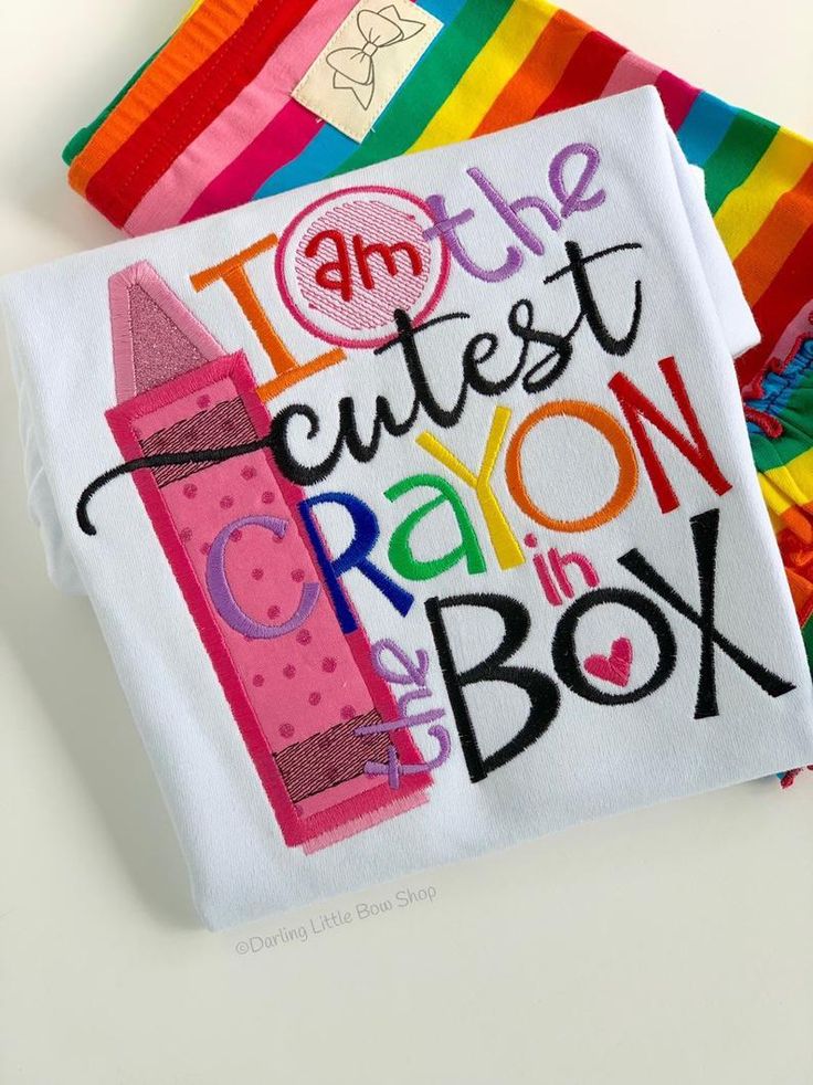 Funny and sweet school shirt in bright colors, "Cutest Crayon in the Box". The design is so colorful and cheerful in pink, turquoise, orange, lime, purple and red, with a sparkly pink crayon tip. This listing includes: -shirt ADD matching crayon hairbow here https://www.darlinglittlebowshop.com/collections/easter/products/crayon-bow-fun-5-6-rainbow-double-stacked-bow-with-crayon-box-center ADD matching shorties, capris or leggings here (shown with rainbow, black and lollipop shorties) https://ww Serenity Room, Cricut Clothes, Toddler Crayons, Pink Crayon, Kindergarten Shirts, Sewing School, Crayon Box, Boutique Items, Daycare Crafts