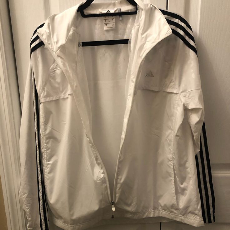 Nwot. White Adidas Windbreaker Jacket. Never Worn. Nice Reflective Design On The Top Of The Jacket. Super Soft And Great Quality. Size Large. Adidas Windbreaker Jacket, White Adidas Windbreaker For Spring, Adidas White Outerwear For Spring, White Adidas Outerwear For Spring, White Adidas Hooded Windbreaker, White Hooded Adidas Windbreaker, Adidas White Outerwear For Fall, White Adidas Outerwear For Fall, Adidas Casual White Track Jacket