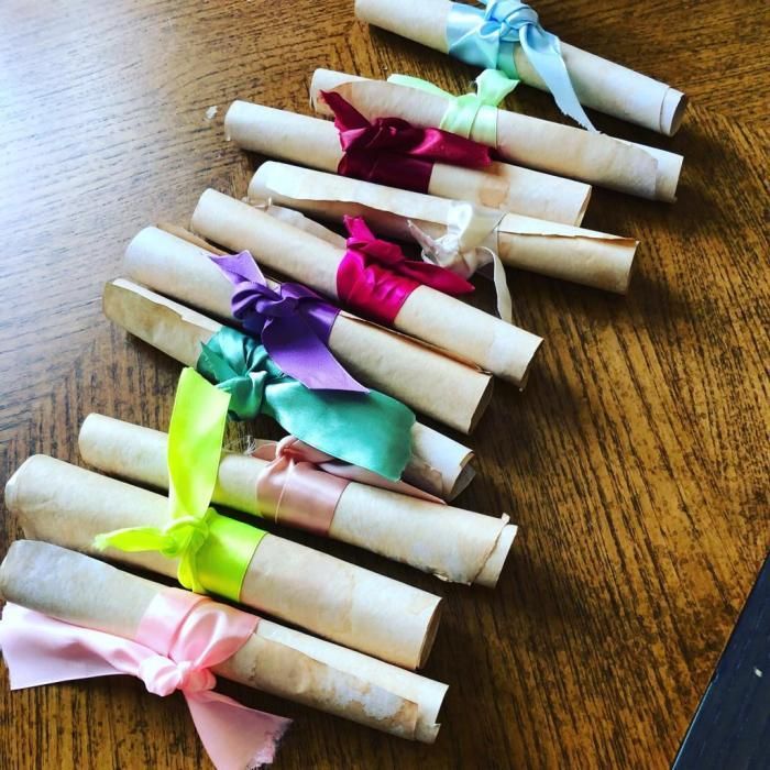 several rolled up paper flowers on a table