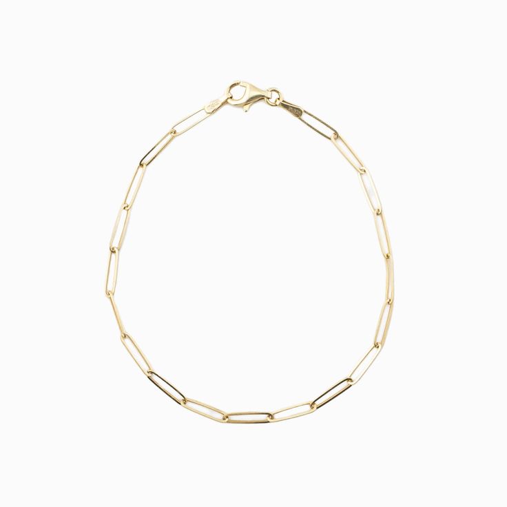 "Simple and delicate bracelet perfect for everyday wear. This bracelet is both dainty and comfortable, making it an ideal addition to any outfit. This paperclip chain bracelet is a stylish and modern piece of jewelry that features a chain made up of interlocking paperclip-shaped links. This type of bracelet is typically crafted from 14 karat gold, which is a high-quality and durable material that is prized for its rich, warm color and lustrous finish. The bracelet is designed to be lightweight and comfortable to wear, making it ideal for everyday use or special occasions. With its sleek and contemporary design, a 14k gold paperclip chain bracelet is a versatile accessory that can be dressed up or down to suit any style. * Made of 14k solid gold * Bracelet length: 7\" * Lobster clasp" Classic Gold Bracelet With Rectangular Links For Everyday, Elegant Paperclip Bracelet With Cable Chain For Everyday, Minimalist Gold Bracelet With Oval Links, Minimalist 14k Gold Oval Link Bracelets, Delicate 14k Gold Chain Bracelet For Everyday, Minimalist Chain Bracelet With Lobster Clasp For Formal Occasions, Timeless Gold Chain Paperclip Bracelet As Gift, Gold Minimalist Paperclip Bracelet For Everyday, Timeless Paperclip Gold Chain Bracelet As Gift