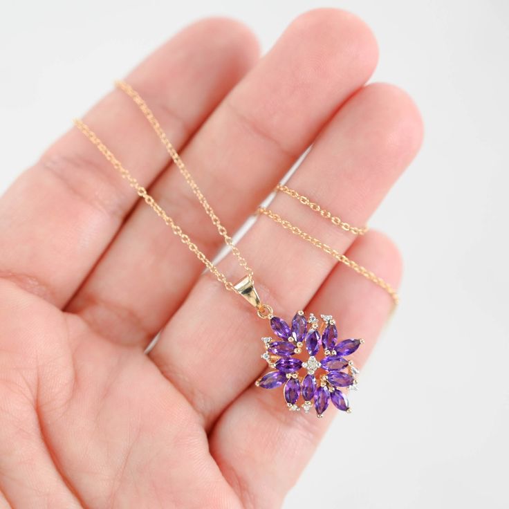 This enchanting 14K Yellow Gold Amethyst and Diamond Flower Charm Rolo Link Necklace is a stunning addition to any jewelry collection. Featuring a beautifully crafted flower charm adorned with vibrant amethyst and sparkling diamonds, this necklace exudes elegance and charm. Weight: 4.1gMaterial: 14K Yellow GoldLength: 18"Width: 1 mmClosure: Spring Ring ClaspPendant: 1" x 0.7" Diamonds: 1 = 0.01CtwColor And Clarity: H/I1Amethyst: 14 x 0.10Ctw = 1.40CtwTotal Carat Weight: 1.41Ctw For more of our jewelry products, please visit our shop 777jewelryLA Free shipping on all orders within USA.International shipping available. We only sell real gold jewelry. We do not sell gold plated or gold filled jewelry. We offer a 30 day money back guaranteed return on all orders. Our goal is to make every cust Elegant Lavender Flower Shaped Jewelry, Purple Gemstone Flower Pendant Necklace, Elegant Flower Shaped Amethyst Jewelry, Purple Jewelry With Flower Charm And Pendant, Purple Jewelry With Flower Pendant And Charm, Purple Flower Pendant Jewelry With Charm, Purple Flower Shaped Gemstone Jewelry, Purple Flower Charm Jewelry, Lavender Flower Shaped Jewelry For Gift