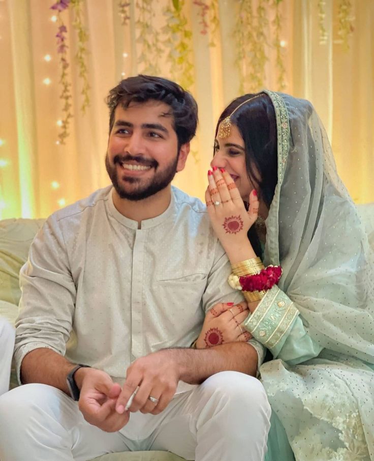 a man and woman sitting next to each other