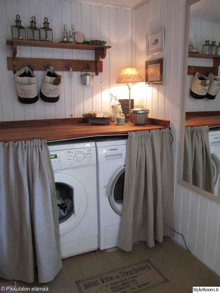 a washer and dryer in a small room