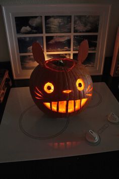 a pumpkin carved to look like a cat