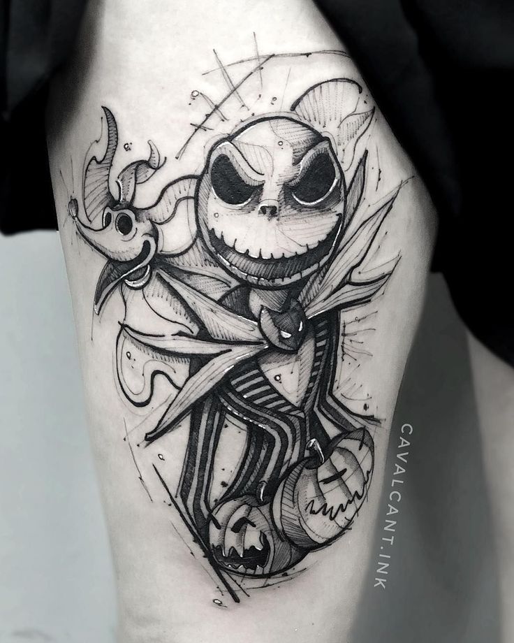 a black and white image of a jack skellingy tattoo on the thigh,