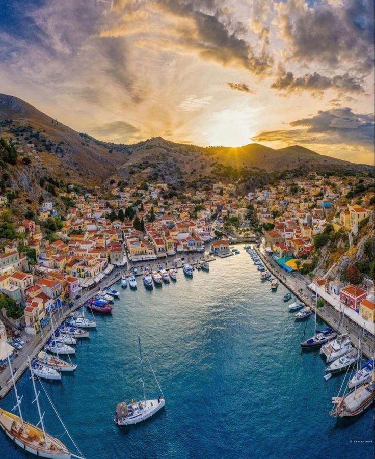 an aerial view of boats docked in the harbor