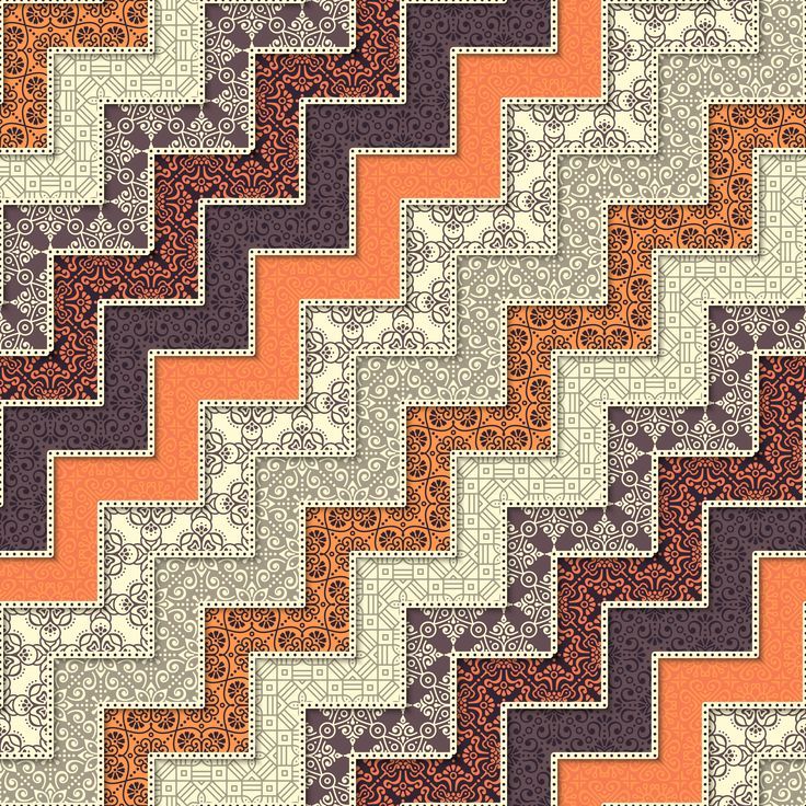 an orange and black quilt with many different patterns on it, including the diagonals