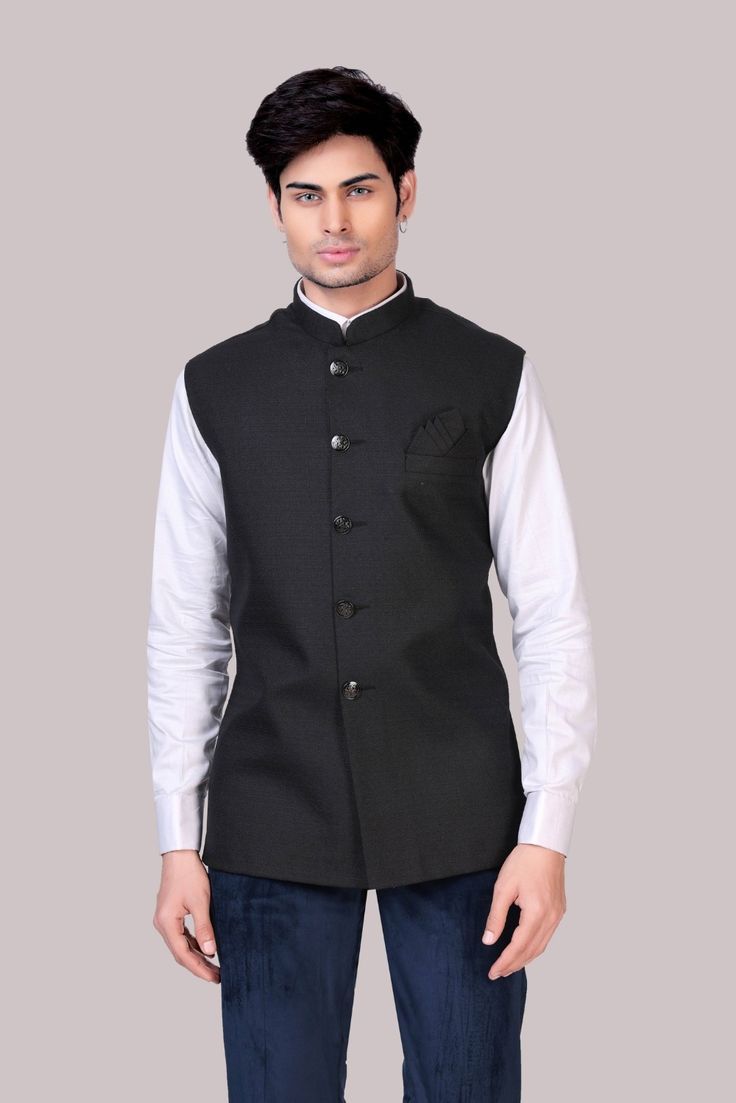 This plain Nehru jacket in black is a classic and versatile piece that is made with terry rayon fabric. It features a mandarin collar and metallic buttons on the placket. The pocket square detail accentuates the overall look of the Nehru jacket. Perfect for weddings, engagement parties and business meetings. Shop black nehru jackets for men online at Tathastu. Shipping Worldwide | 100% Authentic Product Nehru Jacket For Men, Engagement Parties, Nehru Jacket, Nehru Jackets, Jackets For Men, Rayon Fabric, Mandarin Collar, Pocket Square, Formal Event