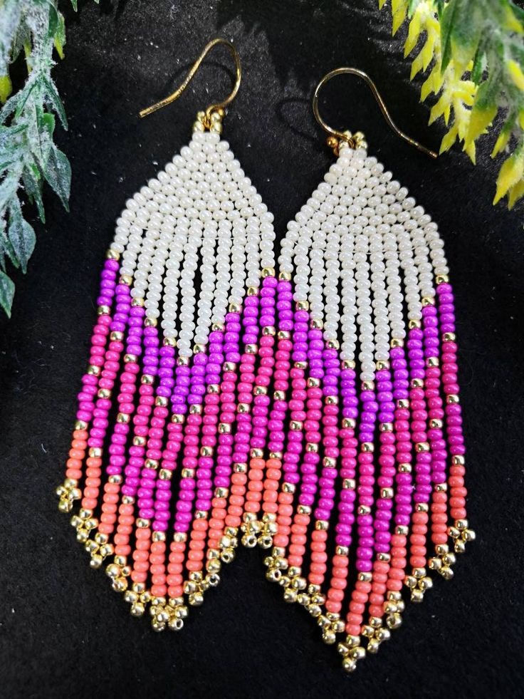 These handwoven pinktastic seed beaded earrings are so fun and vibrant. They are made with beige, pink, purple orange and gold plated Miyuki beads of the highest quality. Who doesn't love an all pink outfit! Wear these fringe dangle earrings for a night out with your girlfriends and you'll surely love the attention. These earrings are packed in a chic cloth bag and can be gifted to your girl gang.  Each pair of earrings are crafted to order. All the earring hooks are nickle free and hypoallergen All Pink Outfit, Handwoven Earrings, Seed Beaded Earrings, Fringe Beaded Earrings, Handmade Dangle Earrings, Beads Craft Jewelry, Western Earrings, Brick Stitch Earrings, Earrings Handmade Dangle