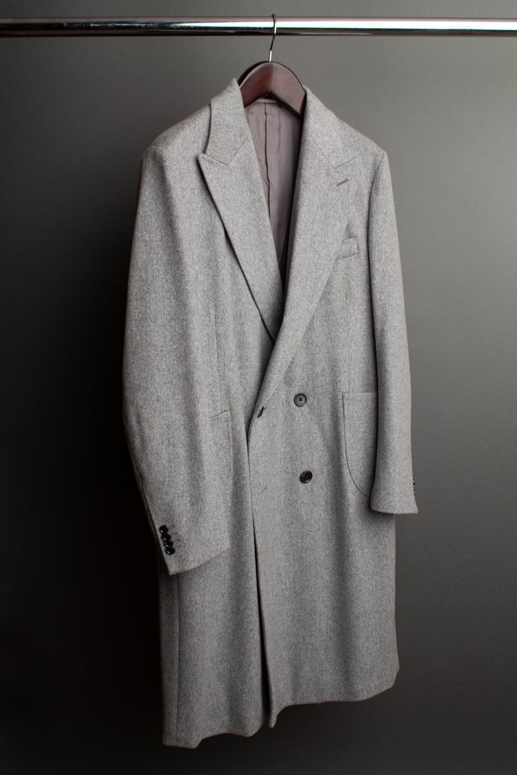 A handmade bespoke coat crafted from the very finest cashmere with the soft luster of fur. Loro Piana Zibeline is a unique fabric with a characteristic wavy look and glossy, 'hammered' effect. This is created using a fascinating traditional technique called teaseling. The surface of the fabric is gently combed with the spiky flowers of dried teasels, raising and directing the nap and lending to its unique rippled effect. Luxury Long Fur Coat, Classic Long Fur Coat For Formal Occasions, Luxury Wool Coat With Hidden Button Closure, Long Wool Coat For Formal Occasions, Luxury Formal Fur Coat, Timeless Long Wool Coat, Luxury Cashmere Outerwear, Luxury Long Cashmere Coat, Designer Cashmere Outerwear For Formal Occasions