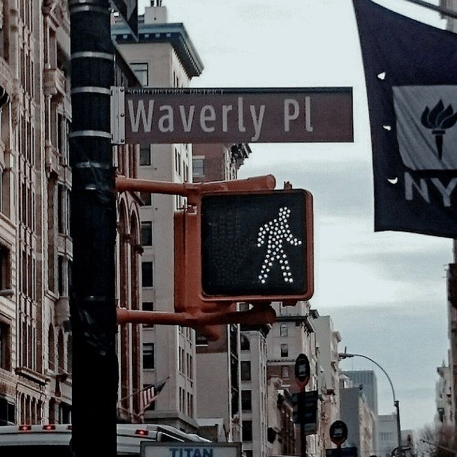 there is a pedestrian crossing sign on the street