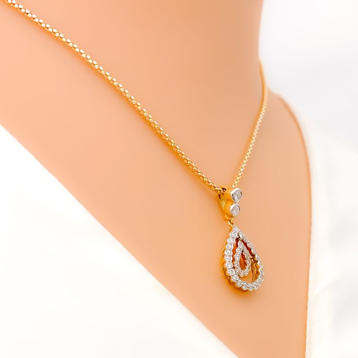 This 18k yellow gold pendant set, weighing 8.3 grams, features a dainty open drop design adorned with 1.14 carats of round brilliant cut diamonds. The diamonds, with an F-G color and VS clarity, add exceptional brilliance and elegance. The pendant measures 1 inch in length, while the matching earrings are 1.1 inches long and come with secure screw back posts. Ideal for those who appreciate luxurious and sophisticated jewelry, this set adds a touch of refined charm to any collection. Its exquisit Formal Yellow Gold Teardrop Diamond Necklace, Formal Yellow Gold Teardrop Pendant Diamond Necklace, Yellow Gold Teardrop Diamond Necklace With Prong Setting, Gold Teardrop Diamond Necklace With Prong Setting, Elegant Gold Drop Necklace With Brilliant Cut, Gold Diamond Cut Teardrop Pendant Necklace, Gold Teardrop Diamond Necklace With Vvs Clarity, Fine Jewelry Yellow Gold Teardrop Diamond Necklace, Yellow Gold Teardrop Diamond Necklace For Anniversary