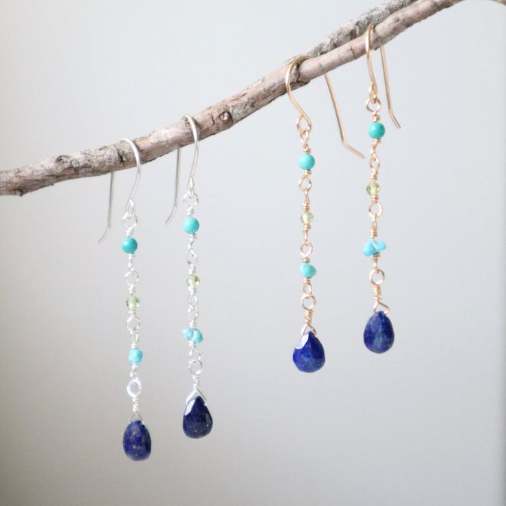 Dive into elegance with these stunning saltwater earrings, showcasing a harmonious blend of lapis, turquoise, and peridot gemstones that beautifully mimic the colors of the ocean. These gorgeous dangles capture the essence of seaside charm, making them a perfect accessory to complement your style with a touch of marine allure. Available in sterling silver or 14k gold filled Lapis, turquoise and peridot gemstones 22g handmade ear wires Earring length: 1 5/8 inches Style tip: Pair with matching Sa Blue Natural Stones Long Drop Jewelry, Blue Long Drop Jewelry With Natural Stones, Blue Long Drop Natural Stone Jewelry, Dainty Sterling Silver Earrings With Gemstone Accents, Dainty Blue Dangle Earrings, Turquoise Dangle Jewelry Birthstone, Turquoise Dangle Birthstone Jewelry, Sapphire Dangle Jewelry With Natural Stones, Sapphire Dangle Earrings With Natural Stones