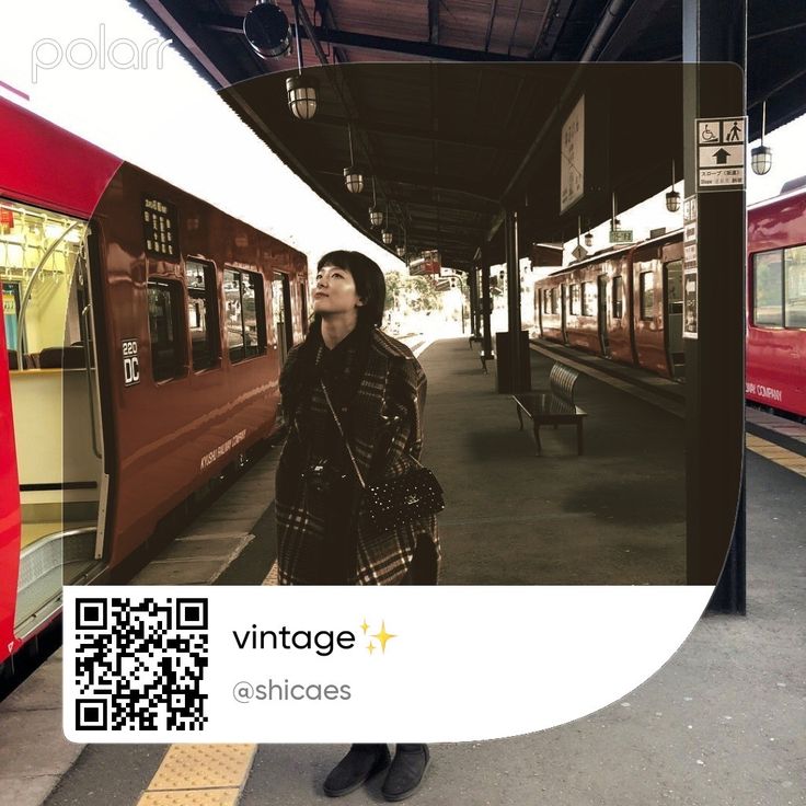 a woman standing next to a train at a station