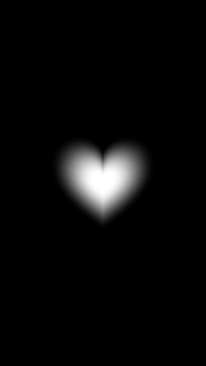 a heart shaped object in the dark sky