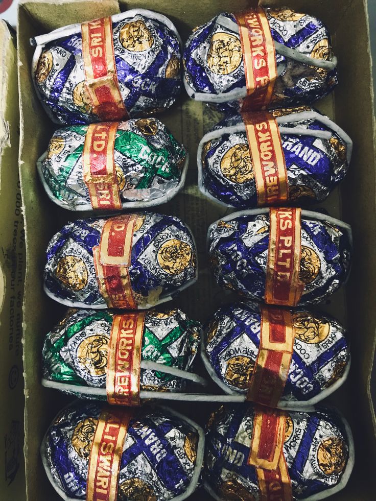 a box filled with lots of chocolate covered eggs