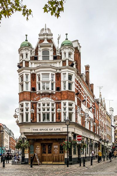 an old brick building on the corner of a street