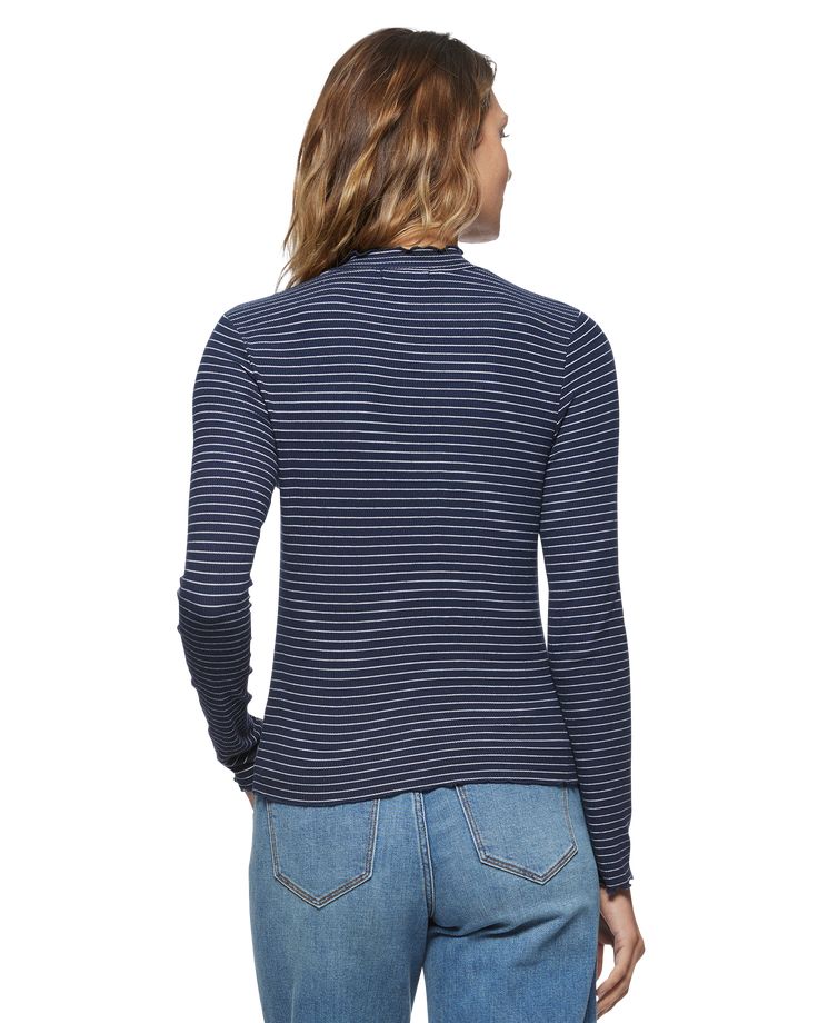 Flaunt your style smarts with our Aleene Mock Neck Top. This must-have stretchy, ribbed knit top features a classic striped print across its mock neckline and long sleeves. The perfectly fitted bodice falls at the waist and pairs perfectly with your favorite denim for a casually cute autumn-ready look. Lettuce edge trim throughout adds a perfect finish that’s totally on-trend. Small: 21” front body length from highest point shoulder 79% Rayon | 16% Poly | 5% Spandex Machine wash; imported Brittn Navy Fitted Top With Ribbed Collar, Navy Fitted Top With Striped Collar, Fitted Navy Top With Striped Collar, Navy Long Sleeve Ribbed Top, Navy Ribbed Long Sleeve Top, Spring Navy Ribbed Top, Spring Ribbed Navy Tops, Navy Ribbed Tops For Spring, Navy Long Sleeve Top With Striped Collar