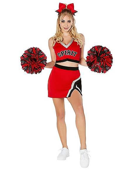 a woman in a cheerleader outfit holding two pom poms