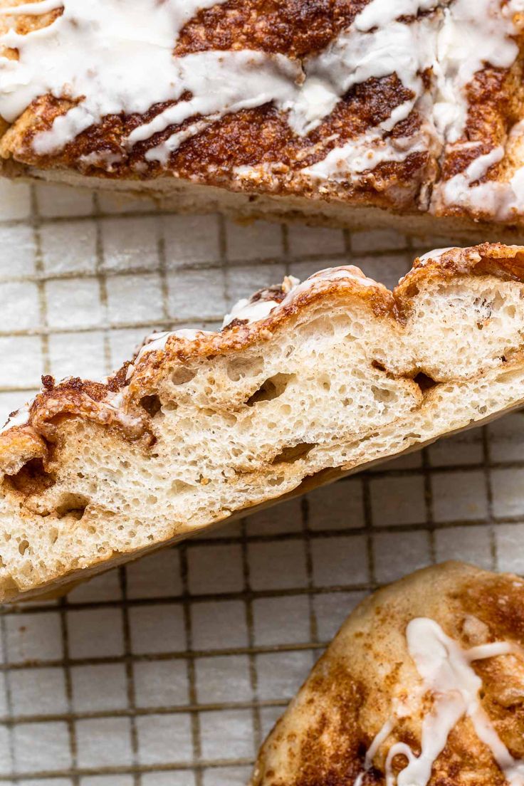 two slices of cinnamon bread with icing on the top and one slice cut in half