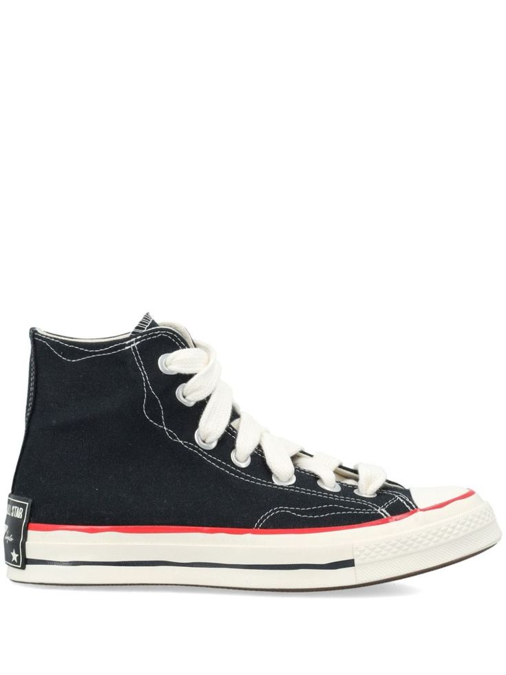 black/white canvas signature Vans Sidestripe signature Chuck Taylor patch logo print to the side eyelet detailing round toe front lace-up fastening ankle-length rubber toecap branded insole flat rubber sole We've partnered with Good On You — an independent agency that rates how brands perform in relation to their impact on the planet, people and animals, with a multi-criteria rating simplified to a five points scale. In order to be awarded our conscious label, larger brands need to score a minim Canvas High-top Sneakers With Logo Print For Streetwear, Canvas High-top Lace-up Sneakers With Logo Print, Casual High-top Sneakers With Logo-print Tongue And White Sole, Lace-up High-top Canvas Sneakers With Logo, Canvas High-top Sneakers With Logo Print, Mid-top Sneakers With Rubber Toe Cap For Streetwear, Urban Converse Sneakers With Rubber Toe Cap, High-top Sneakers With Logo Patch And White Sole, Black Canvas Sneakers With Logo Print