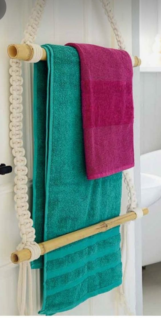 two towels are hanging on a towel rack